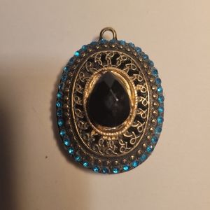 Vintage Oval bronze pedant with dark blue crystals and black big in middle